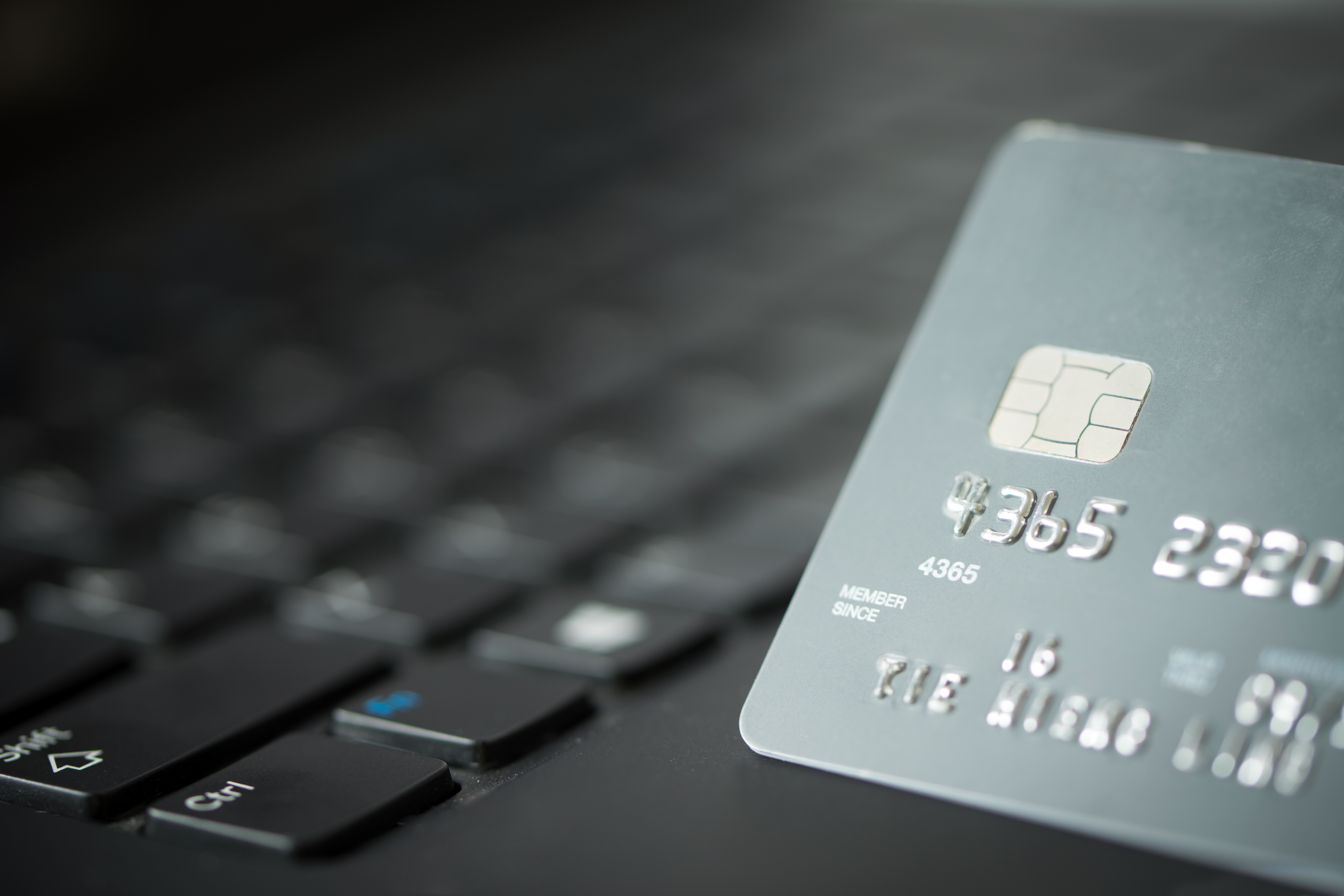 credit-card-on-laptop-PREJC57 credit-card-on-laptop-PREJC57